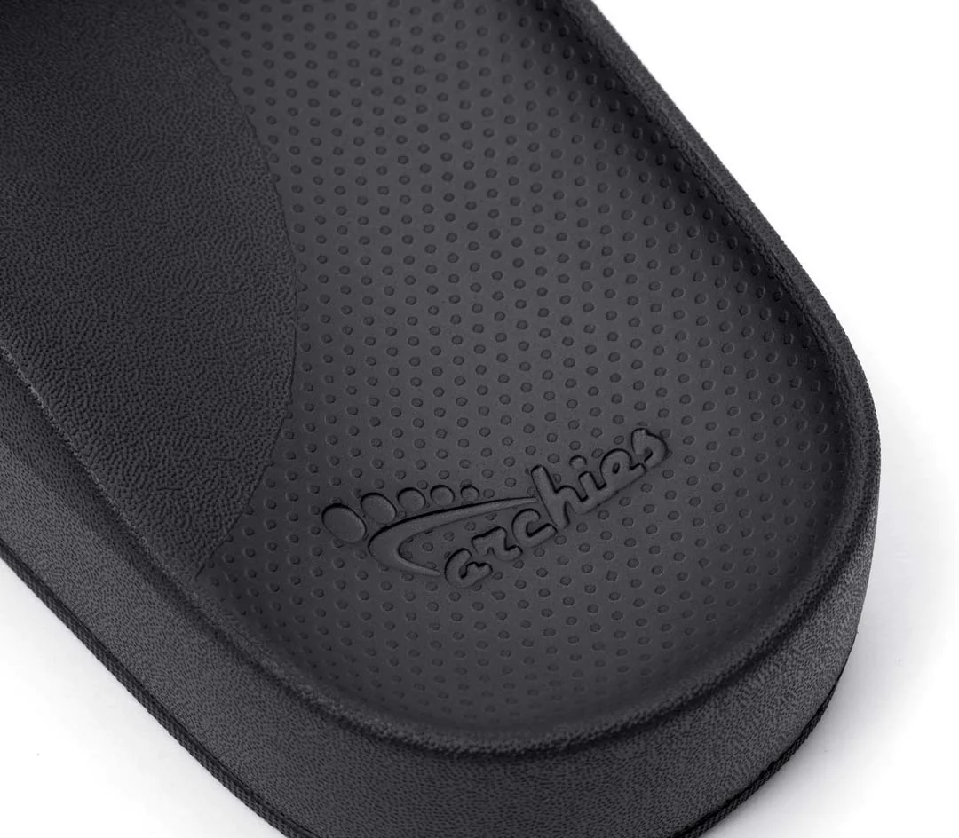 Archies arch support slides in a black style showing the heel of the slide