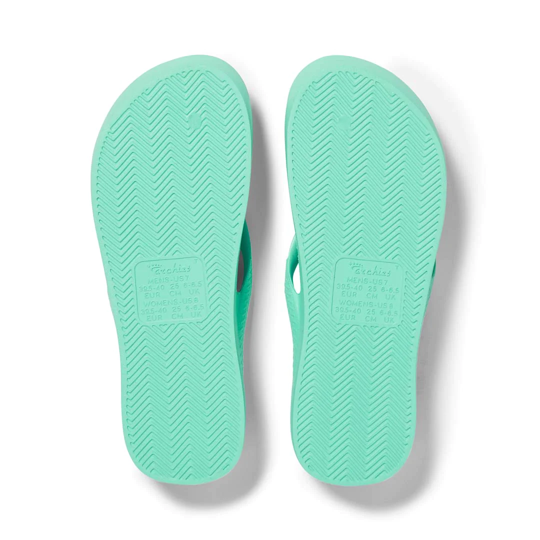 Archies Arch Support kids Thongs in mint green pictured upside down from the bottom