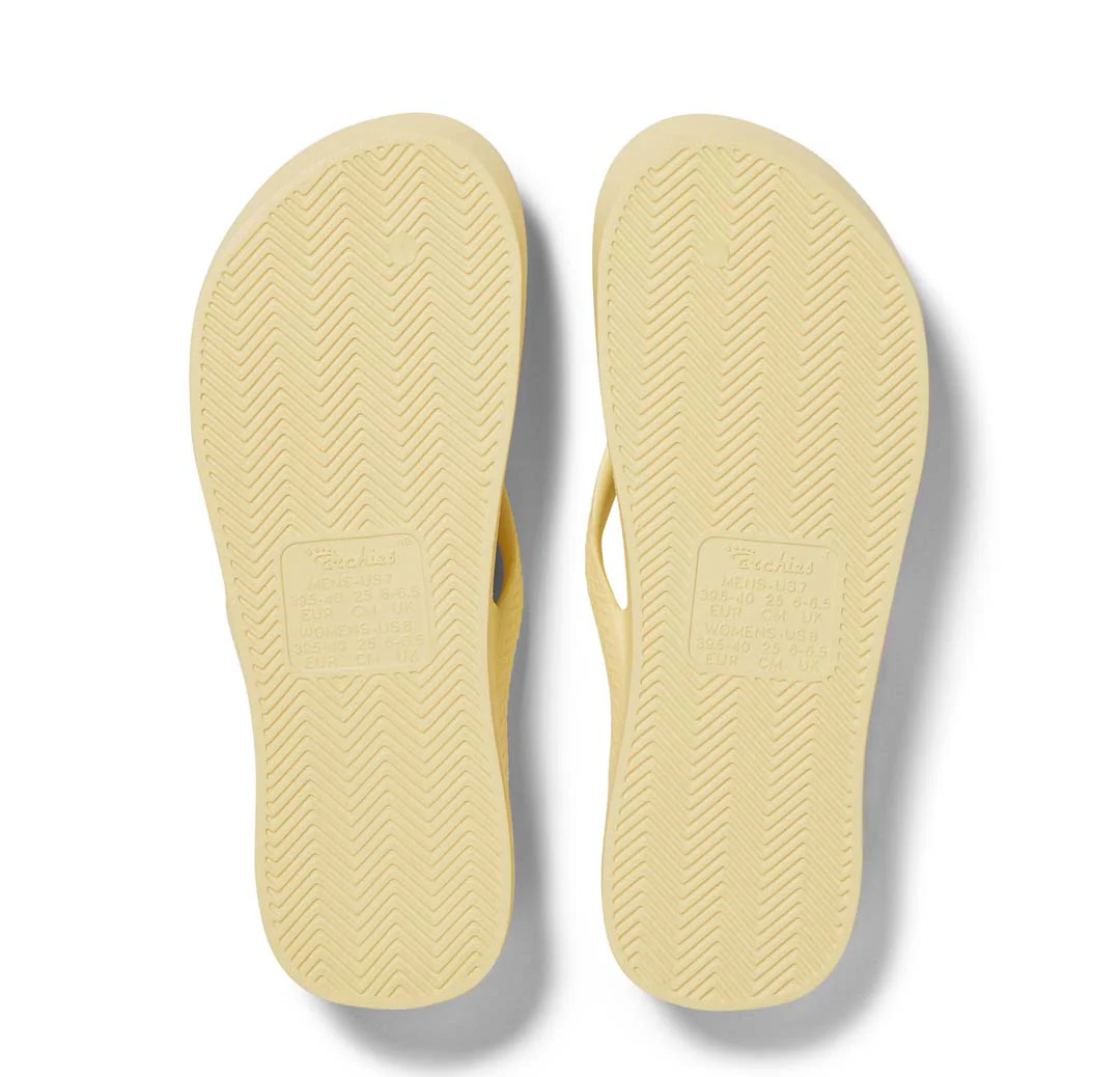 Archies Arch Support Thongs in lemon pictured upside down from the bottom