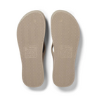 Archies Arch Support Thongs in taupe pictured upside down from the bottom