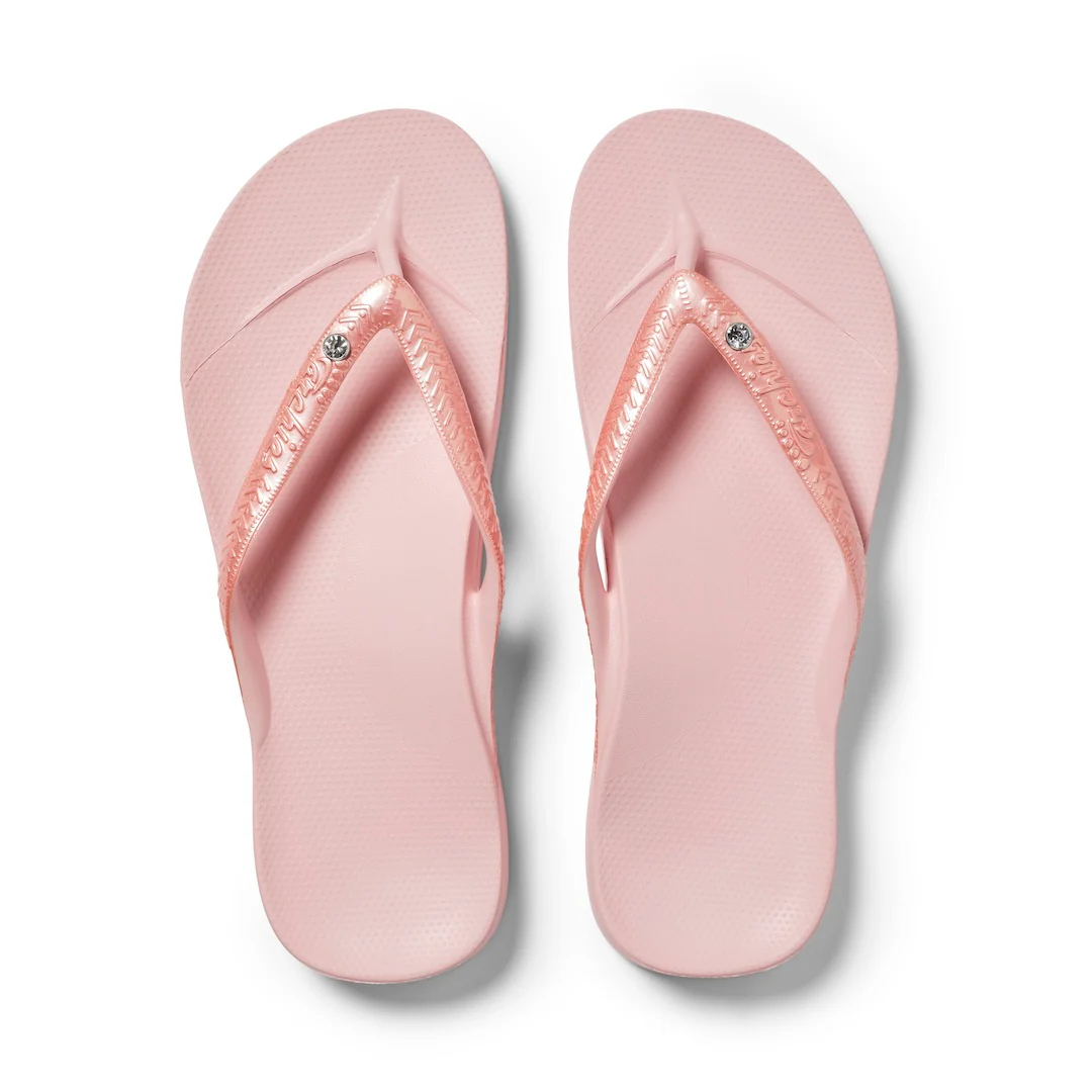 Archies arch support thongs in pink shimmer shown from above