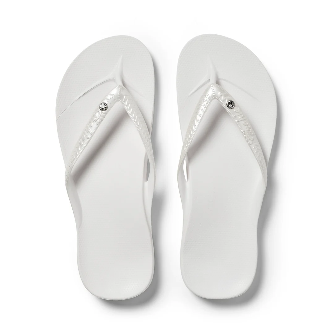 Archies arch support thongs in white shimmer shown from above