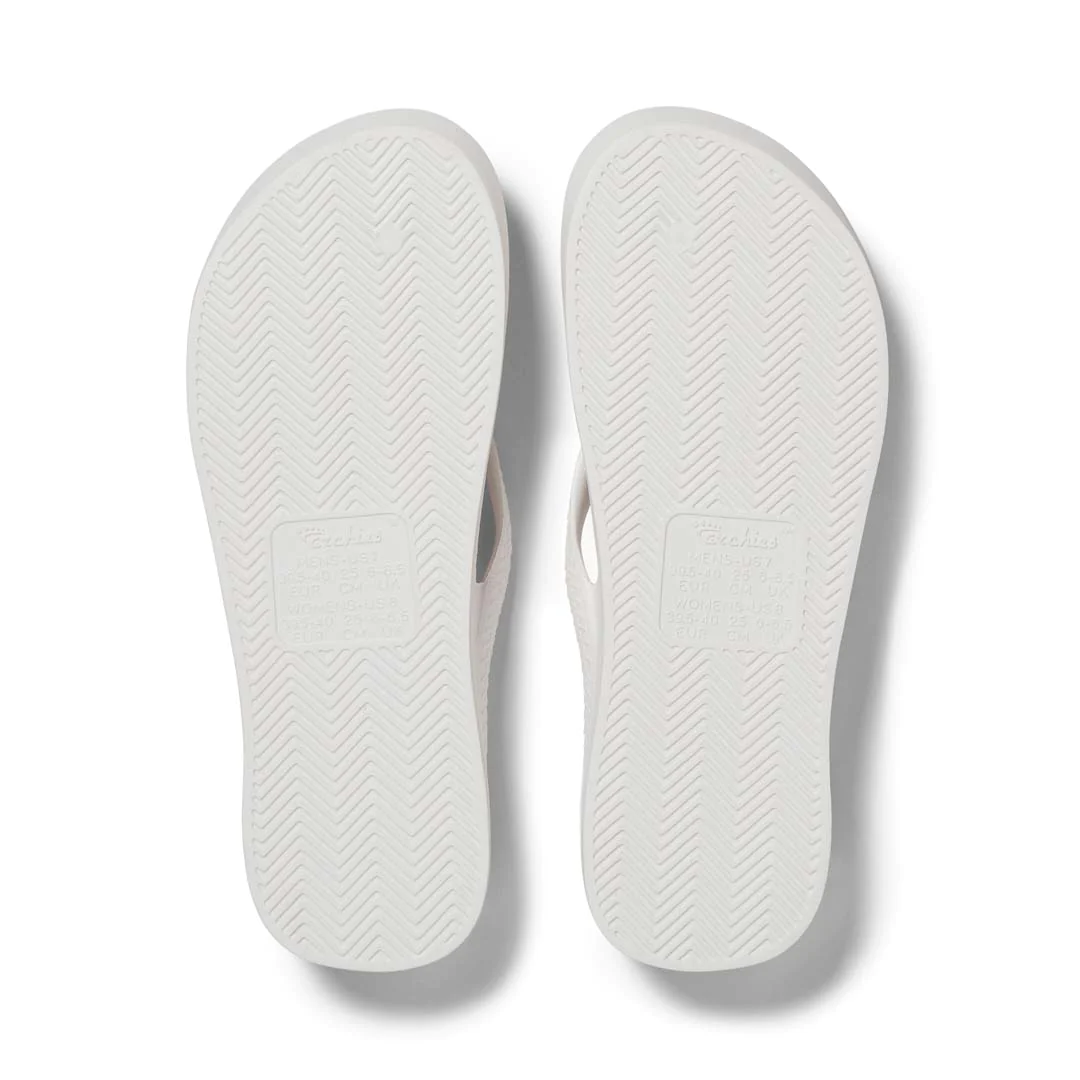 Archies Arch Support Thongs in white pictured upside down from the bottom